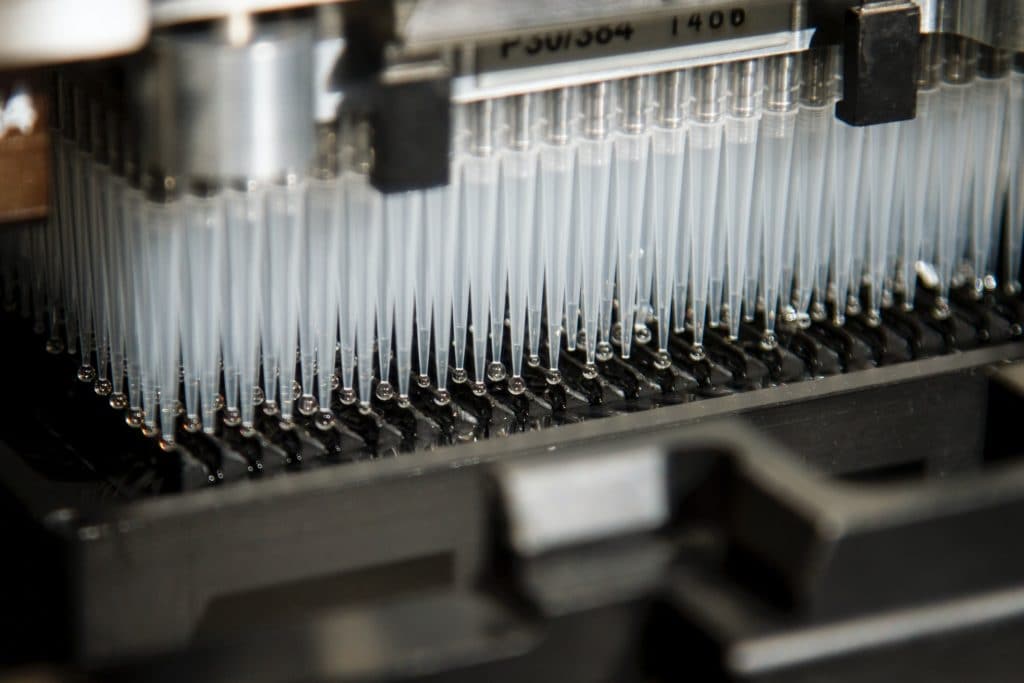 Tubes of liquid in DNA automated genotyping machine in a lab